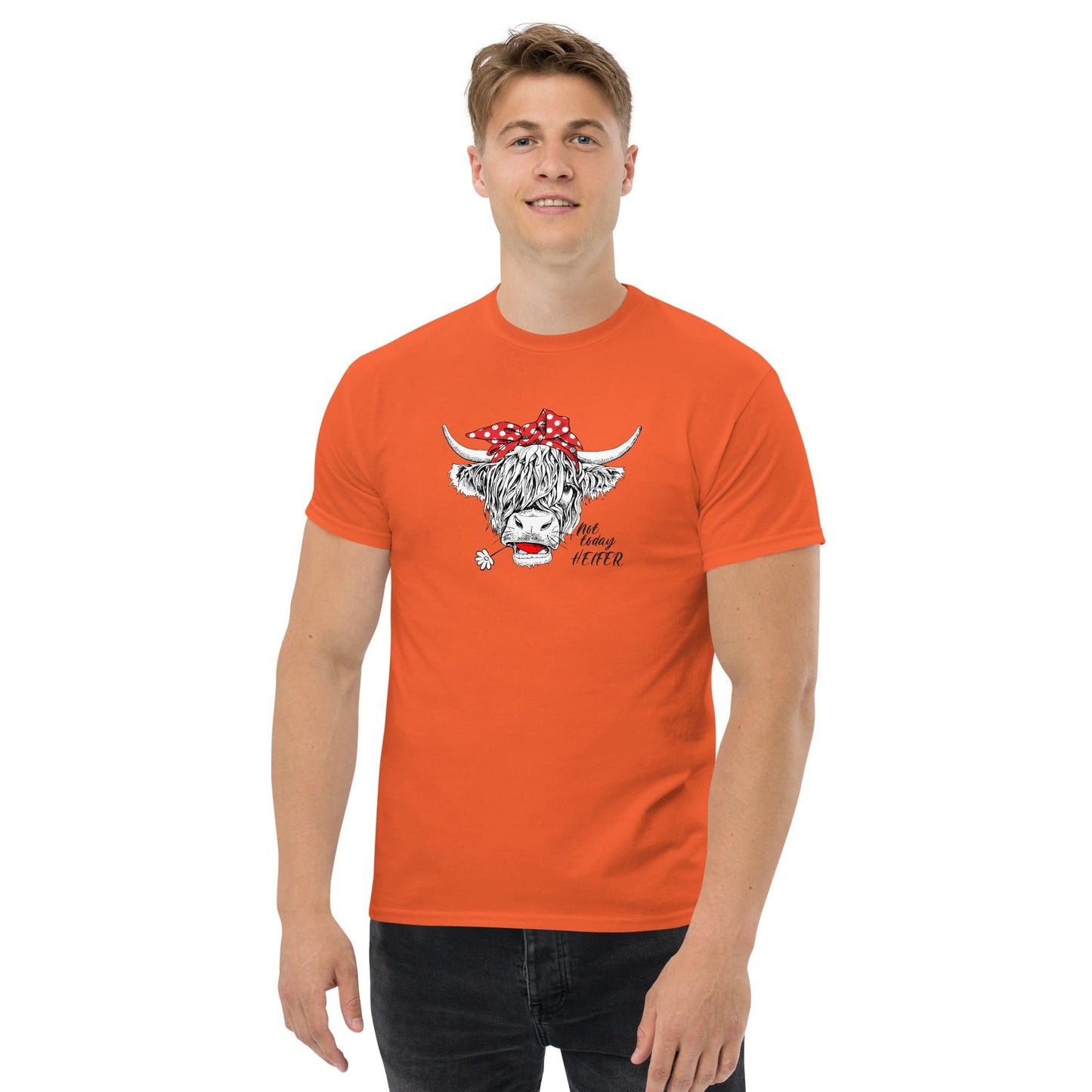 Orange t-shirt with cow graphic.